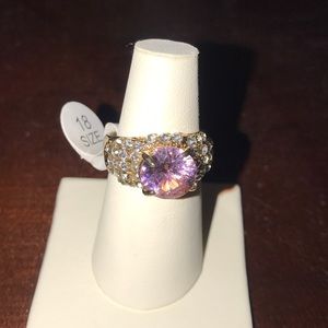 Gold ring with pink center stone
